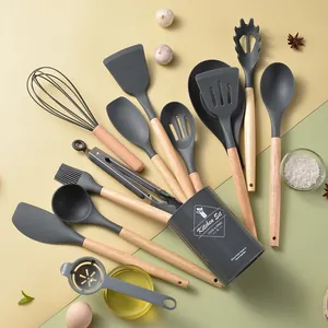 14-piece grey silicone kitchen utensil set with wooden handles and storage bucket