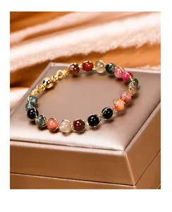 Detailed view of a handmade colorful tourmaline beaded bracelet with 14K gold wire wrap