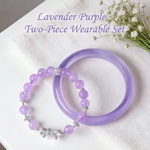 Elegant lavender purple crystal bead bracelet and bangle set with silver bow charm.