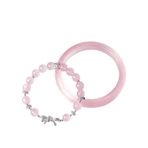 Elegant natural pink crystal beaded bracelet with bow charm and matching bangle set