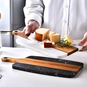 Elegant acacia wood and marble spliced cutting board perfect for cheese and charcuterie