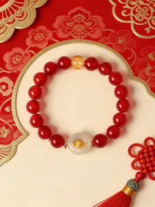 Close-up of natural red agate bracelet with white agate Ping'an buckle and zodiac charm