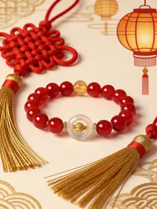 Detail of red agate zodiac bracelet with white agate Ping'an buckle charm