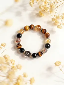 Vista detallada de pulsera de cuentas de piedras naturales con ojo de tigre y cuarzo rutilado