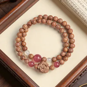 Double loop natural cedar wood beaded bracelet with rose carving and strawberry quartz
