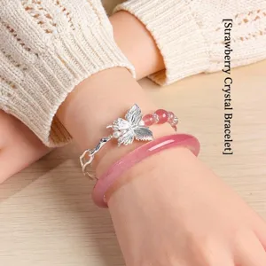 Elegant strawberry quartz bracelet set featuring a silver butterfly charm and pink bangle
