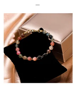 Close-up of colorful tourmaline bead bracelet with magnetic clasp on velvet