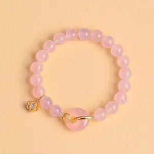 Elegant natural pink crystal beaded bracelet with gold flower charm and agate donut
