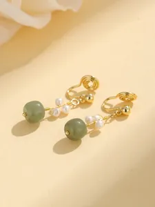 Elegant gold clip-on earrings with green jade beads and pearls, spiral non-pierced design