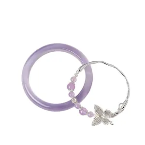Elegant purple cat eye bangle and crystal butterfly charm bracelet set for stacking.