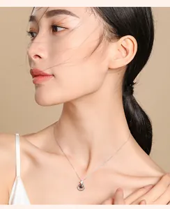 Detail shot of a silver projection necklace on an Asian model with elegant skin tones