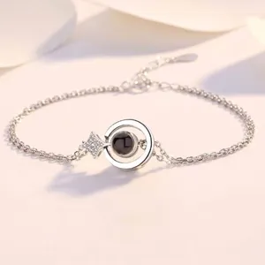 Elegant silver-plated heart memory bracelet with star charm and 'I love you' projection stone.