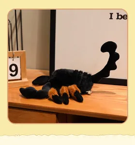 Detailed macro view of a soft black plush scorpion toy with realistic furry brown legs