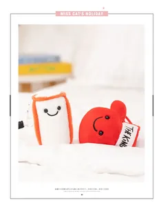 Detailed view of adorable plush boxing glove and sandbag toys resting on soft white bedding