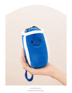 Close-up detail of a miniature blue boxing punch bag plush toy with a cute smile