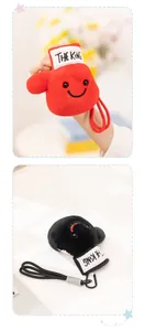 Plush boxing glove toy keychain with smiling face and The King embroidery details