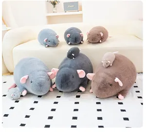Realistic plush rat toys in various sizes and colors displayed in a cozy home setting