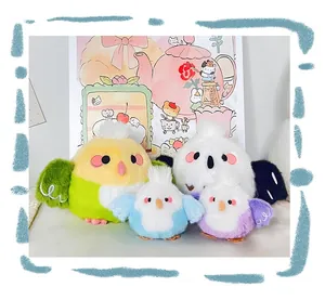 Group of four colorful cute round bird plushies in different sizes and pastel colors