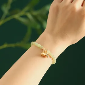Elegantes Armband aus natürlicher grüner Hetian-Jade mit goldenen Lotus-Anhängern