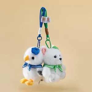 Close-up of cute seagull and polar fox plush keychains with colorful ropes and clips