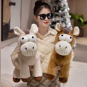 Funny plush horse toy with big eyes and wide grin, held by a model in lifestyle setting