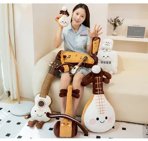 Collection of cute musical instrument plush toys including guitar, piano, and lute styles