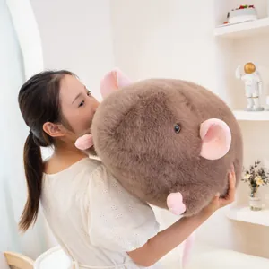 Giant brown fluffy mouse plush doll soft round rat decorative pillow held by woman