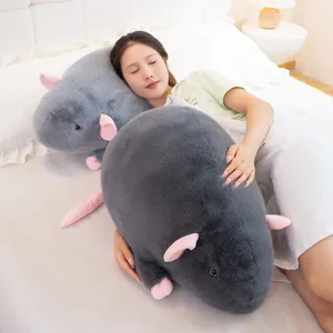 Ultra soft giant grey fancy rat plush toy being used as a cozy bed pillow by model