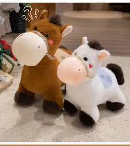 Detail view of two cute plush horse toys in brown and white finishes on a soft carpet