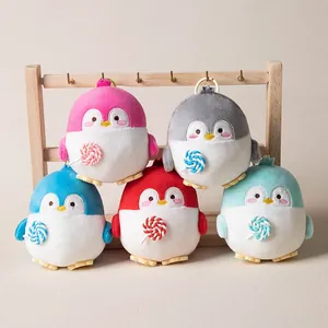 Set of 5 colorful penguin plush keychains holding lollipops for backpack decoration