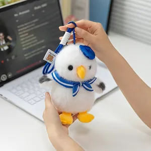Cute white plush seagull keychain charm with sailor hat and blue bow tie decoration