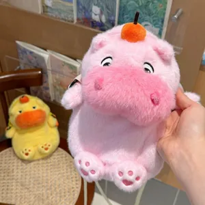 Close-up of the soft pink plush capybara phone bag with cute embroidered facial expressions