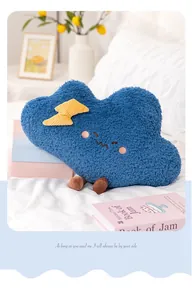 Cozy blue cloud plush pillow with a lightning bolt in a warm home setting.