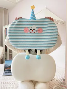 Cute blue striped cartoon nap pillow and white memory foam belly pillow shown on bed