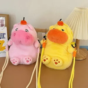 Detail view of cute pink and yellow plush capybara crossbody bags with long straps.
