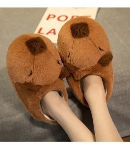 Close-up of adorable brown Capybara plush slippers designed for cozy winter women's home wear