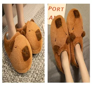 Close-up of cute capybara plush slippers for winter comfort and warmth.
