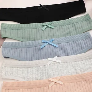 Close-up of colorful ribbed cotton women's panties featuring delicate bow details