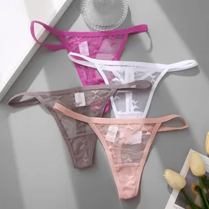 Detail view of colorful sexy lace thongs with elegant butterfly pattern embroidery