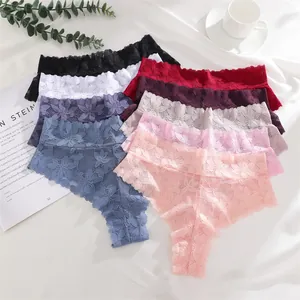 Detailed view of assorted floral lace thongs in various colors on a white backdrop