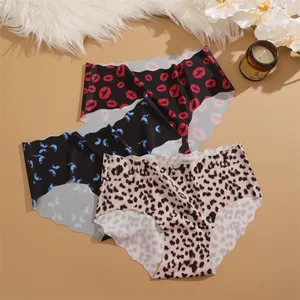 Seamless women's mid-waist ice silk panties with cute prints like lips, butterflies, and leopard.
