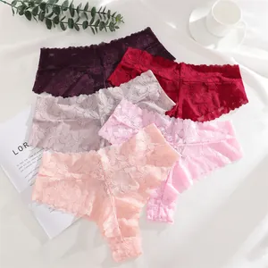 Detail showing a colorful collection of sexy floral lace thong underwear for women.