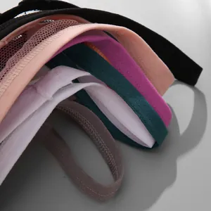 Detailed view of colorful seamless lace thong straps in various soft pastel tones