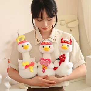 Three adorable themed white plush ducks being held by a model for Valentine's Day gifts