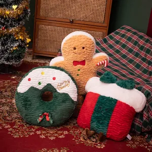 Set of Christmas plush pillows featuring gingerbread man and holiday wreath designs