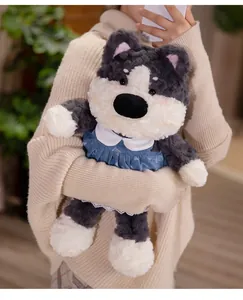 Detail view showing a cute husky plush toy wearing a blue dress being held in arms