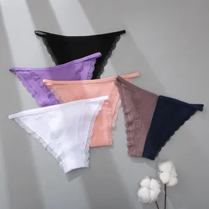 Detailed view of colorful ribbed cotton panties featuring delicate lace trim and thin straps