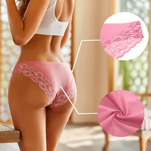 Close-up detail of pink lace-trimmed seamless panties shown on a model in sunlight
