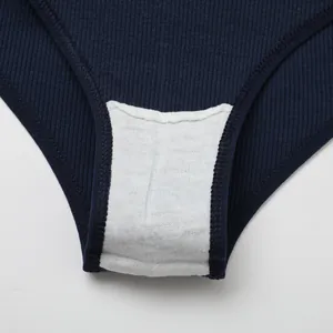 Close-up detail of the breathable white cotton crotch lining on navy blue ribbed panties