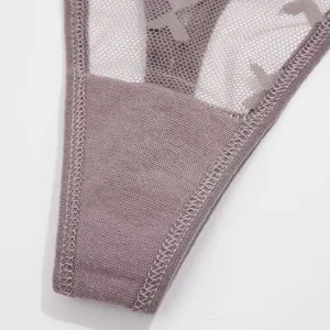 Close-up detail showing the delicate lace mesh and neat stitching on a grey thong